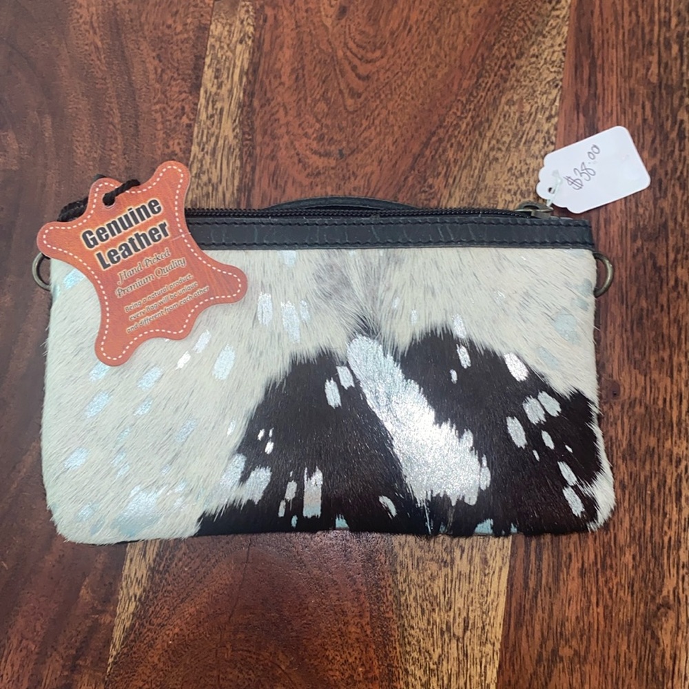 Cute mini crossbody bag. Comes with strap.